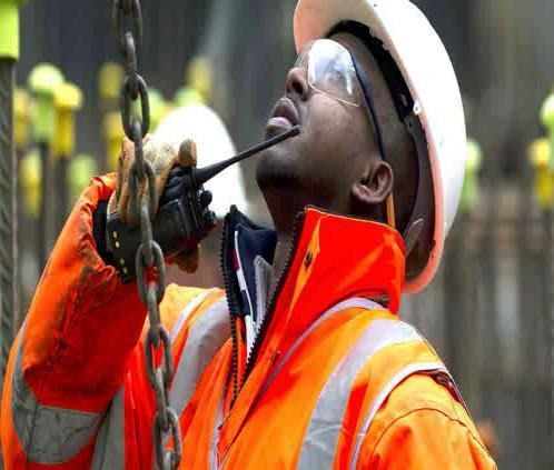 Worker wearing a hard hat and high-visibility clothing
